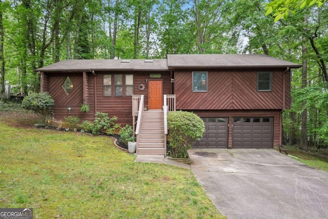 3679 Regent Dr NW, Kennesaw, GA 30144 - raised ranch with an attached garage, driveway, and a front yard