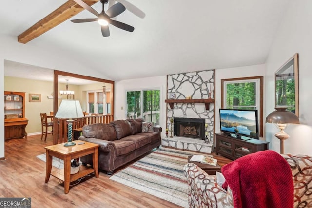3679 Regent Dr NW, Kennesaw, GA 30144 - living area featuring a ceiling fan, wood finished floors, a fireplace, baseboards, and lofted ceiling with beams