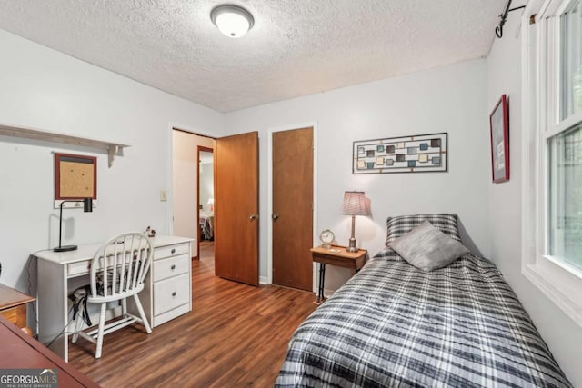 3679 Regent Dr NW, Kennesaw, GA 30144 - bedroom with a textured ceiling and wood finished floors