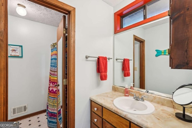 3679 Regent Dr NW, Kennesaw, GA 30144 - bathroom with visible vents, tile patterned floors, and vanity