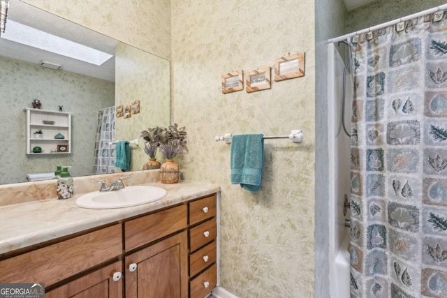3679 Regent Dr NW, Kennesaw, GA 30144 - full bath with vanity, wallpapered walls, and curtained shower