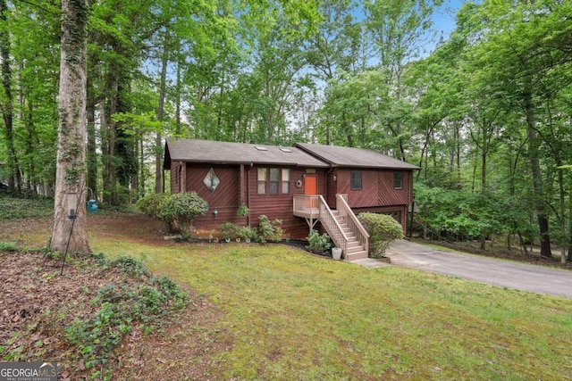 3679 Regent Dr NW, Kennesaw, GA 30144 - view of front of home with concrete driveway, a front lawn, and a garage
