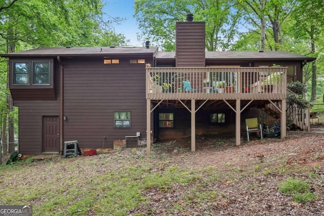 3679 Regent Dr NW, Kennesaw, GA 30144 - back of property featuring stairs, a chimney, central AC, and a deck