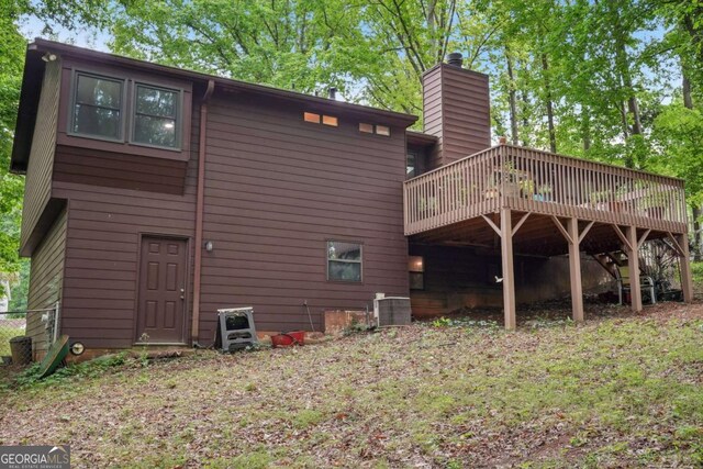 3679 Regent Dr NW, Kennesaw, GA 30144 - back of house with a chimney and a deck