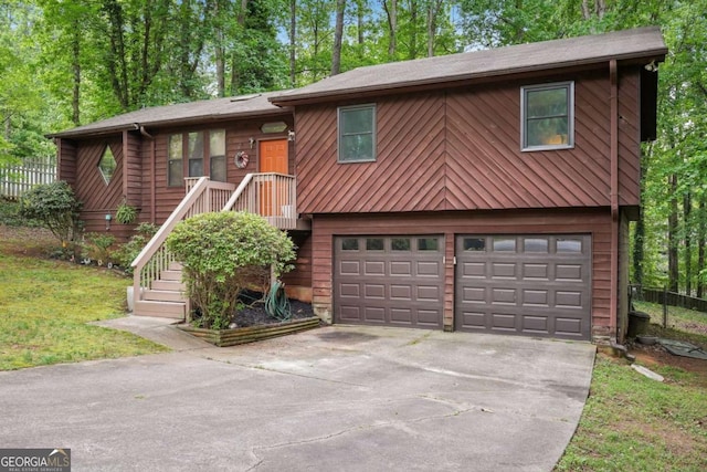 3679 Regent Dr NW, Kennesaw, GA 30144 - view of front of home with a garage, fence, and driveway