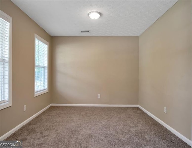 145 Tara Way, Covington, GA 30016 - carpeted empty room featuring baseboards