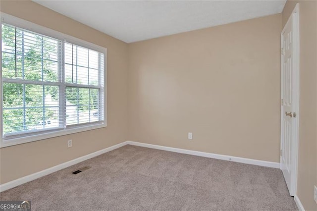 145 Tara Way, Covington, GA 30016 - carpeted empty room with baseboards