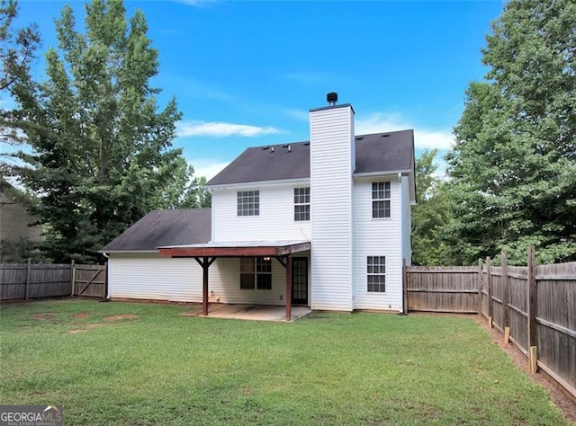 145 Tara Way, Covington, GA 30016 - rear view of house with a fenced backyard, a chimney, and a patio