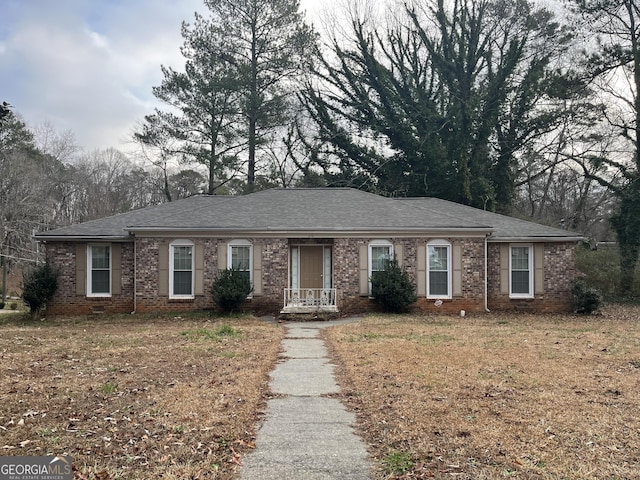 676 Bralorne Dr, Stone Mountain, GA 30087 - ranch-style house featuring a shingled roof and brick siding