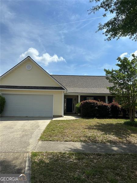 3218 Watson Woods Way, Loganville, GA 30052 - single story home with concrete driveway, roof with shingles, and a garage