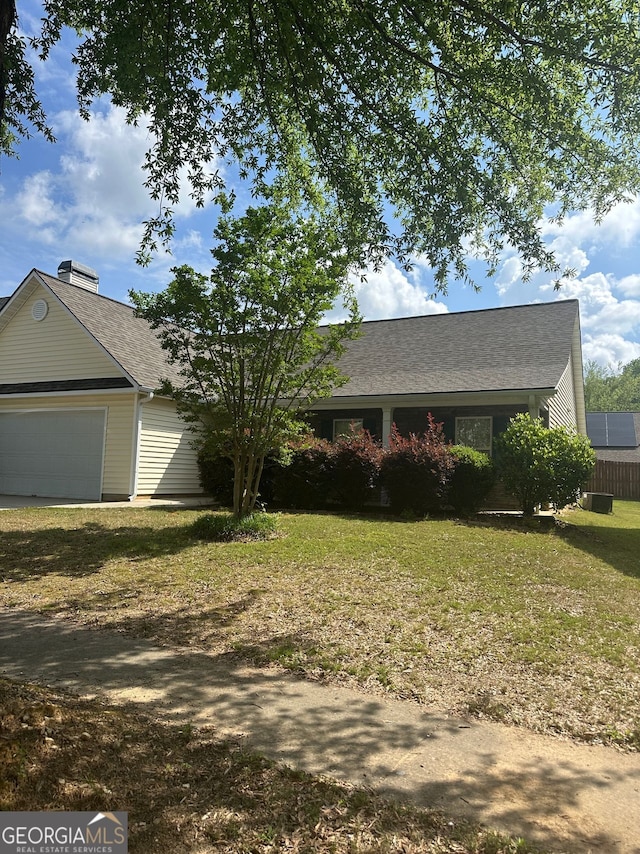 3218 Watson Woods Way, Loganville, GA 30052 - ranch-style home with a garage, roof with shingles, and a front lawn