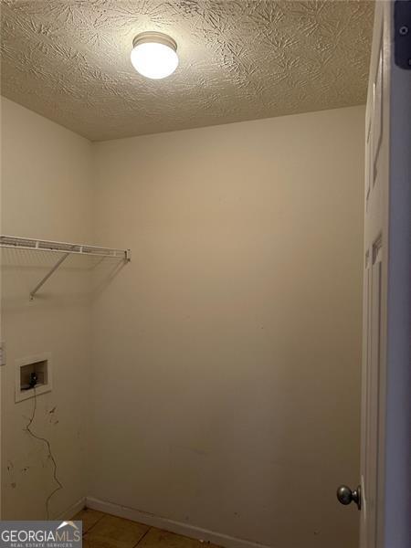 3218 Watson Woods Way, Loganville, GA 30052 - laundry room featuring baseboards, light tile patterned floors, laundry area, and washer hookup