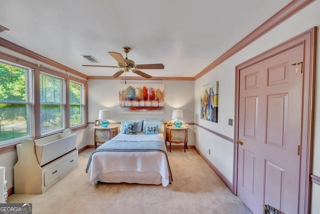 bedroom featuring crown molding, baseboards, light carpet, and visible vents