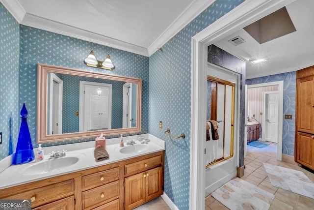 full bathroom featuring crown molding, tile patterned floors, visible vents, and a sink