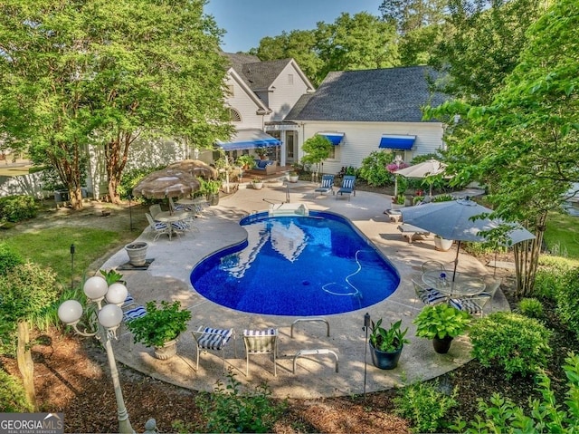 pool with a patio area
