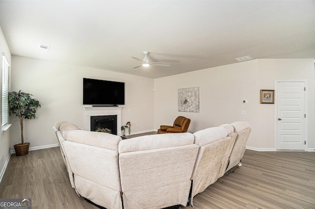 496 River Run Dr, Dallas, GA 30132 - living room with a ceiling fan, wood finished floors, baseboards, and a glass covered fireplace