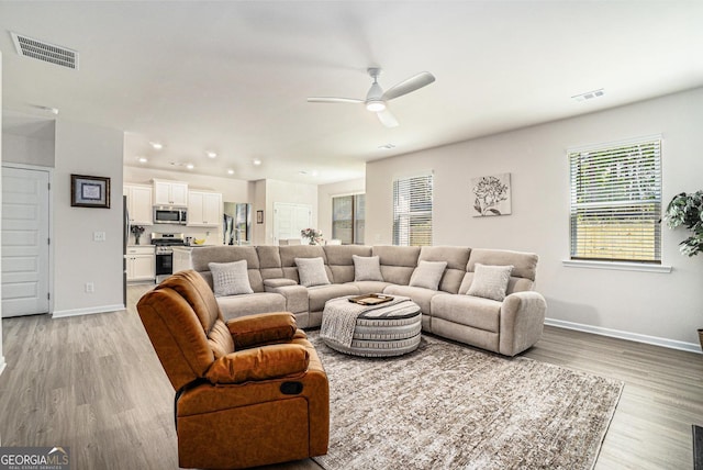496 River Run Dr, Dallas, GA 30132 - living room with a ceiling fan, light wood-type flooring, and baseboards