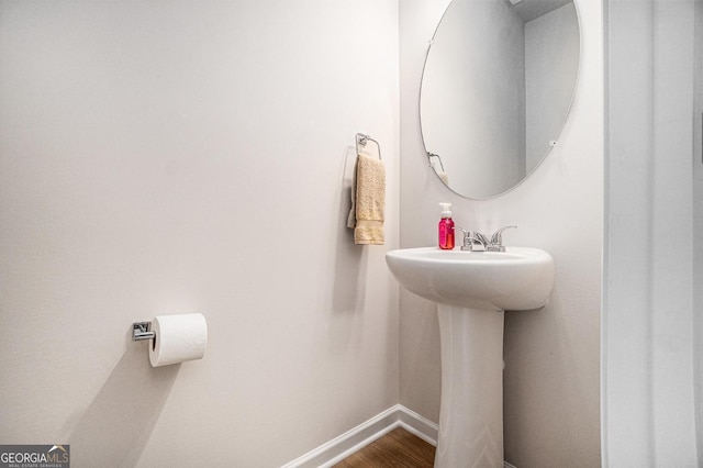 496 River Run Dr, Dallas, GA 30132 - bathroom with baseboards, wood finished floors, and a sink