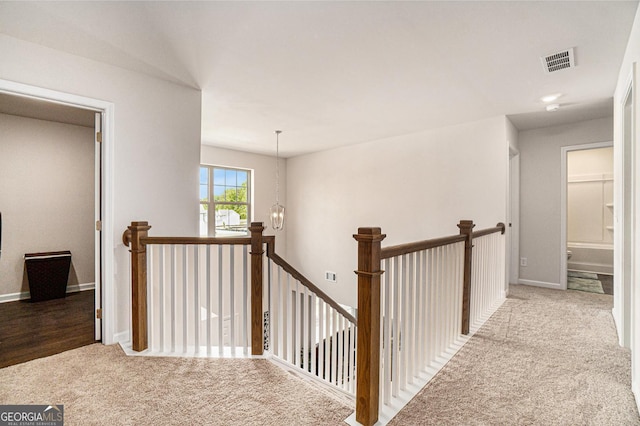 496 River Run Dr, Dallas, GA 30132 - hallway with an upstairs landing, carpet floors, and baseboards