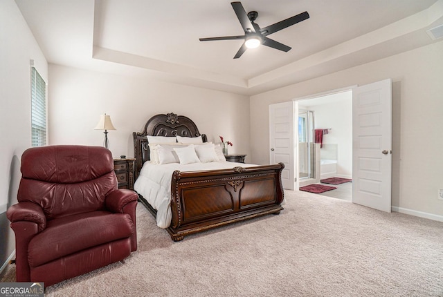 496 River Run Dr, Dallas, GA 30132 - bedroom with a tray ceiling, carpet floors, ensuite bathroom, baseboards, and ceiling fan