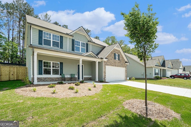 496 River Run Dr, Dallas, GA 30132 - view of front of property with stone siding, covered porch, driveway, and a garage