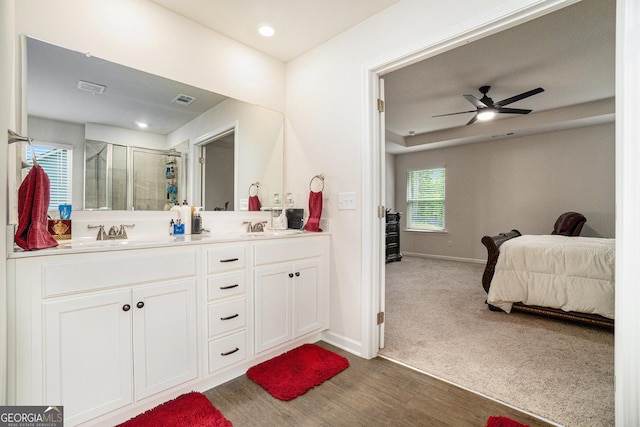 496 River Run Dr, Dallas, GA 30132 - bathroom with ensuite bathroom, baseboards, a stall shower, double vanity, and wood finished floors