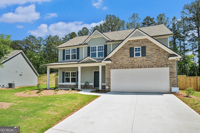 496 River Run Dr, Dallas, GA 30132 - craftsman-style house featuring stone siding, driveway, a porch, a garage, and central air condition unit