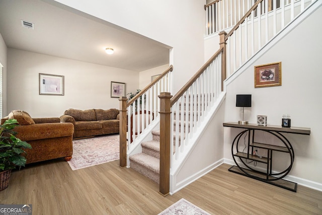 496 River Run Dr, Dallas, GA 30132 - stairs with wood finished floors and baseboards