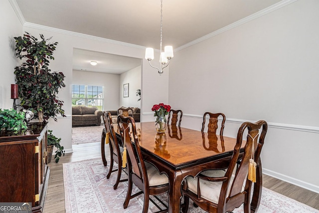 496 River Run Dr, Dallas, GA 30132 - dining room with light wood-type flooring, crown molding, and baseboards