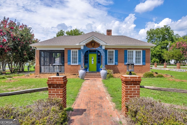 157 Hartwell St, Royston, GA 30662 - bungalow-style home featuring fence, a chimney, brick siding, and a front yard