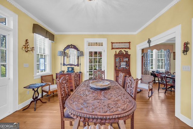 157 Hartwell St, Royston, GA 30662 - dining space featuring crown molding, baseboards, and wood finished floors