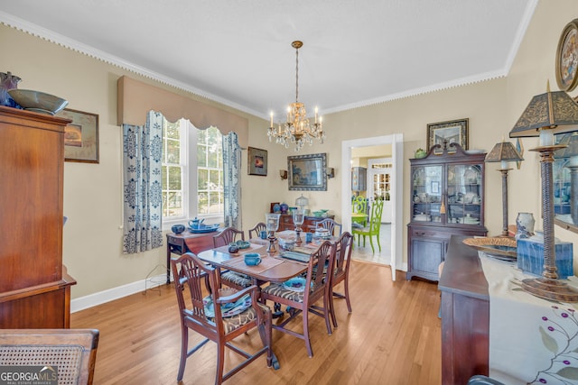 157 Hartwell St, Royston, GA 30662 - dining room with an inviting chandelier, ornamental molding, and light wood-type flooring