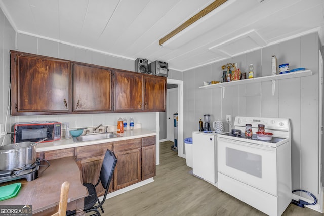 157 Hartwell St, Royston, GA 30662 - kitchen with open shelves, a sink, light countertops, electric stove, and light wood-style floors