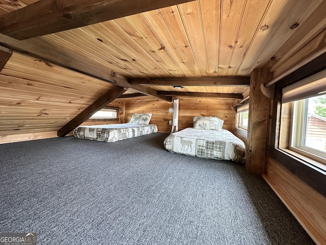 bedroom with wooden walls, wood ceiling, beam ceiling, and carpet floors