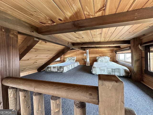 bedroom with carpet floors, wooden walls, and wooden ceiling