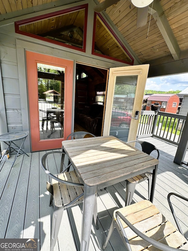 deck with outdoor dining area