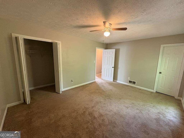 1231 Providence Way, Lawrenceville, GA 30046 - unfurnished bedroom with carpet flooring, a closet, a ceiling fan, and a textured ceiling