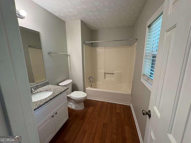 1231 Providence Way, Lawrenceville, GA 30046 - full bath with wood finished floors, a textured ceiling, vanity, and shower / tub combination