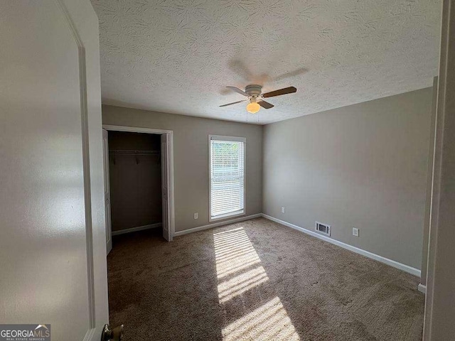 1231 Providence Way, Lawrenceville, GA 30046 - unfurnished bedroom featuring carpet flooring, a textured ceiling, ceiling fan, and a closet