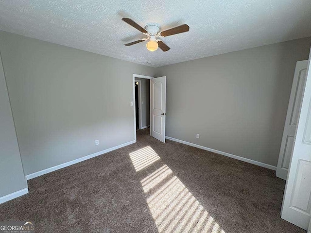 1231 Providence Way, Lawrenceville, GA 30046 - unfurnished bedroom with carpet floors, a textured ceiling, and a ceiling fan