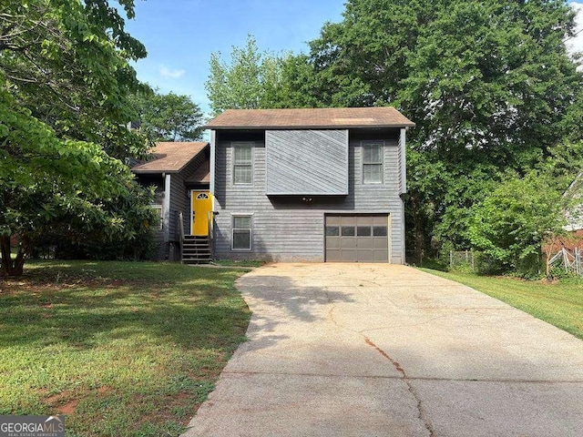 1231 Providence Way, Lawrenceville, GA 30046 - view of front facade with a front yard, an attached garage, and driveway