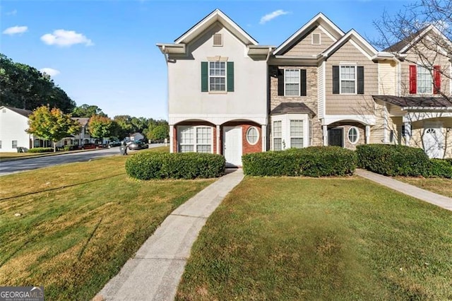 6099 Camden Forrest Cv, Riverdale, GA 30296 - view of property featuring stone siding and a front yard