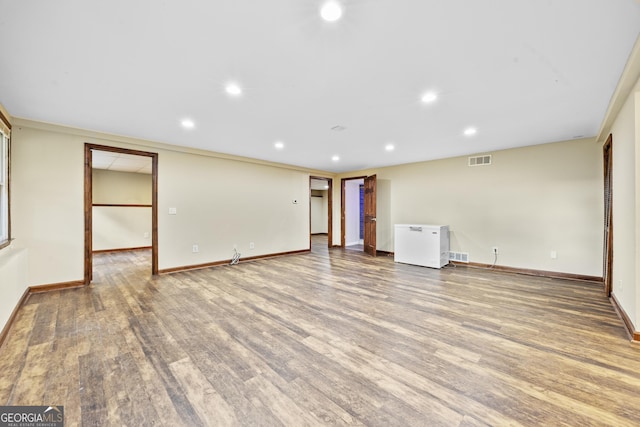 4805 Forest Way Ct NE, Marietta, GA 30066 - spare room featuring wood finished floors and recessed lighting