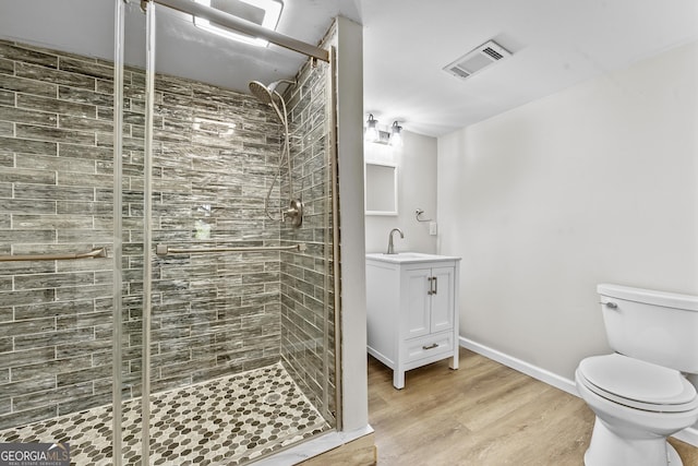 4805 Forest Way Ct NE, Marietta, GA 30066 - full bathroom featuring vanity, a shower stall, and wood finished floors