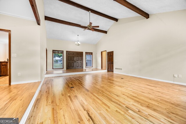 4805 Forest Way Ct NE, Marietta, GA 30066 - unfurnished living room featuring visible vents, light wood-style flooring, ceiling fan with notable chandelier, and beam ceiling