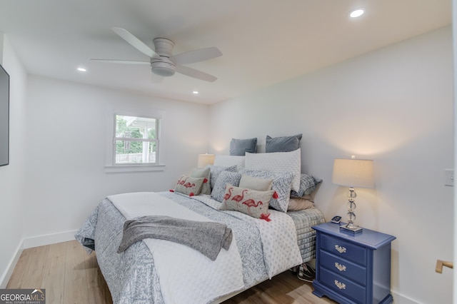 bedroom featuring baseboards, a ceiling fan, recessed lighting, and wood finished floors
