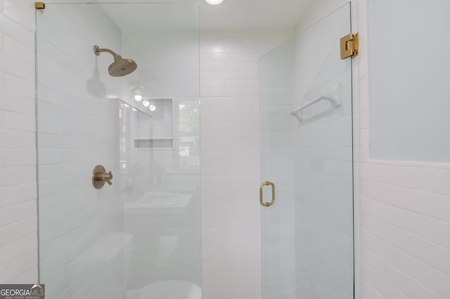 full bathroom with a shower stall