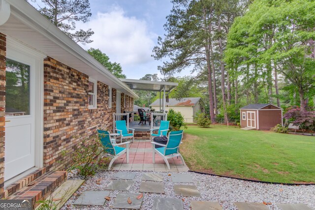view of patio featuring an outdoor structure and a shed
