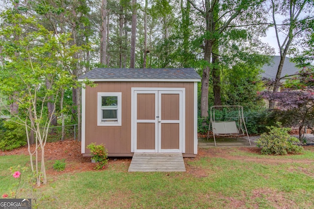 view of shed with fence