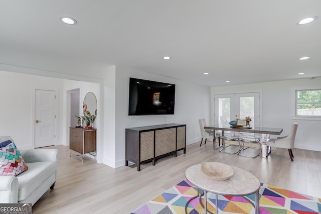 living area featuring recessed lighting, baseboards, french doors, and light wood-style floors